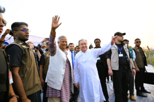 Chief Adviser Muhammad Yunus and UN Secretary-General António Guterres wave to Rohingya refugees during their visit to a camp in Cox’s Bazar.