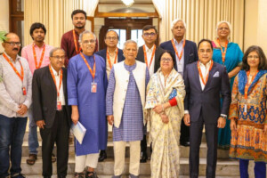 Members of the Media Reform Commission pose with Chief Adviser Professor Muhammad Yunus after submitting their report in Dhaka.