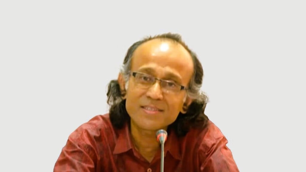 Rakhal Raha speaking at an event.