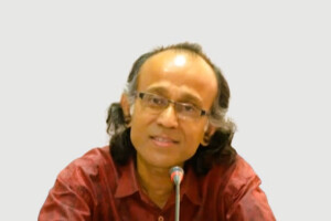 Rakhal Raha speaking at an event.