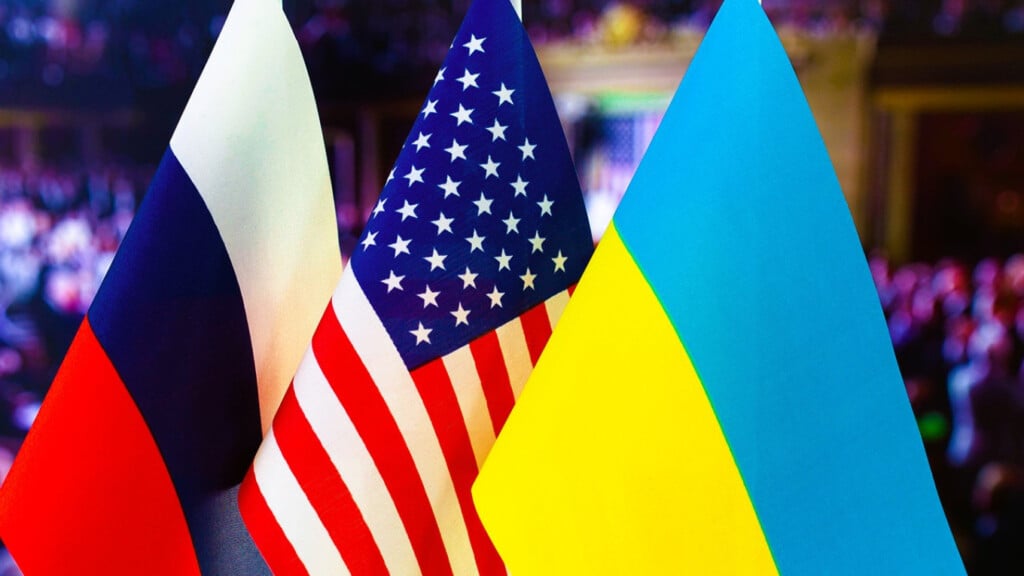 "Flags of Russia, the United States, and Ukraine symbolizing diplomatic discussions on the Ukraine conflict.