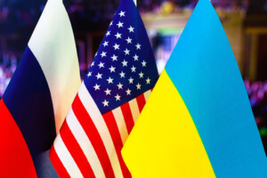 "Flags of Russia, the United States, and Ukraine symbolizing diplomatic discussions on the Ukraine conflict.