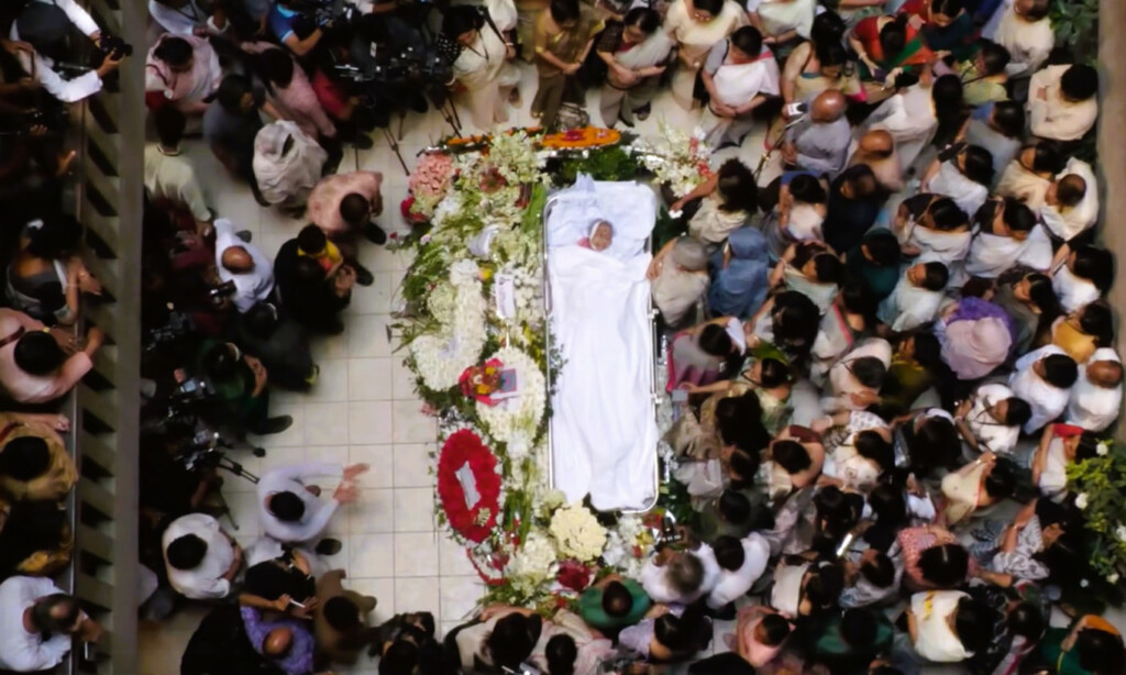 Aerial view of mourners surrounding the flower-covered body of Dr Sanjida Khatun at Chhayanaut Sangskriti Bhaban in Dhaka.