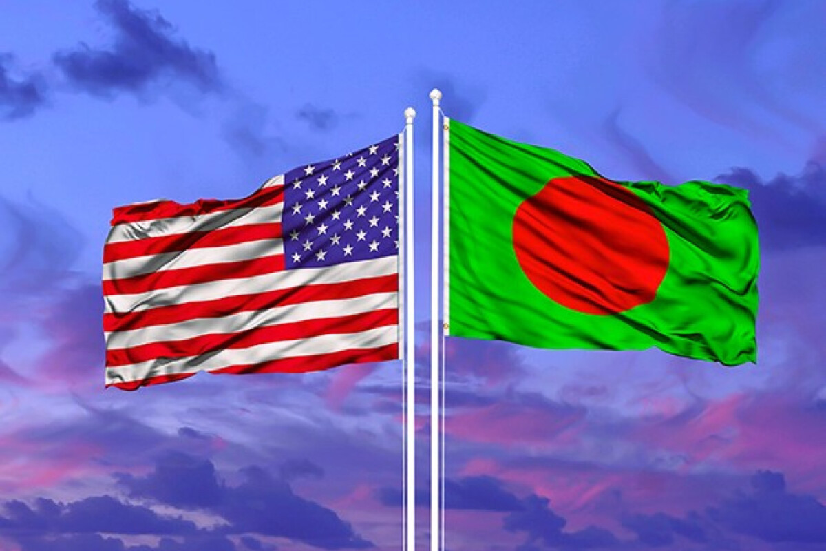 United States and Bangladesh flags waving side by side against a sunset sky, symbolizing bilateral relations.