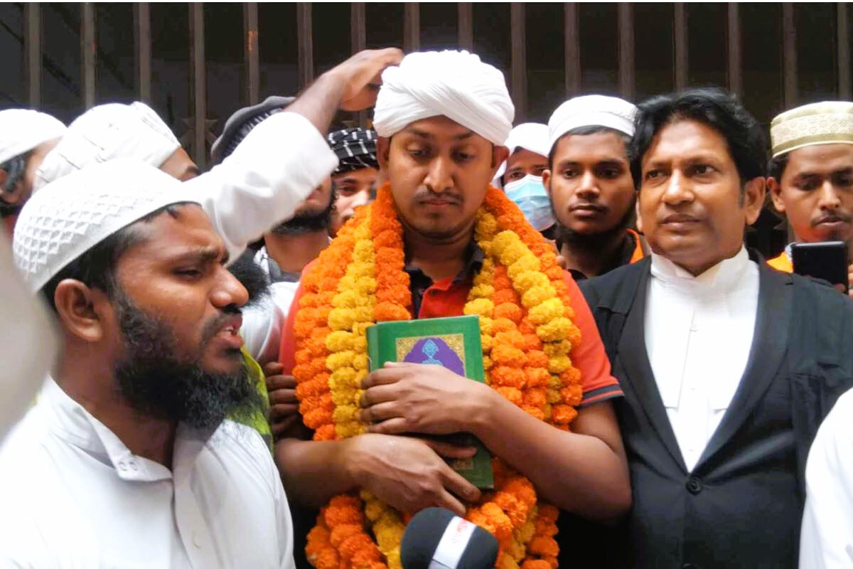 Mostofa Asif surrounded by supporters after being granted bail in Dhaka.