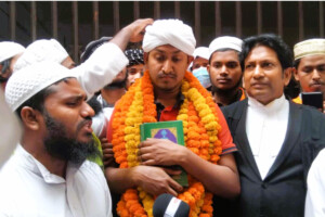 Mostofa Asif surrounded by supporters after being granted bail in Dhaka.