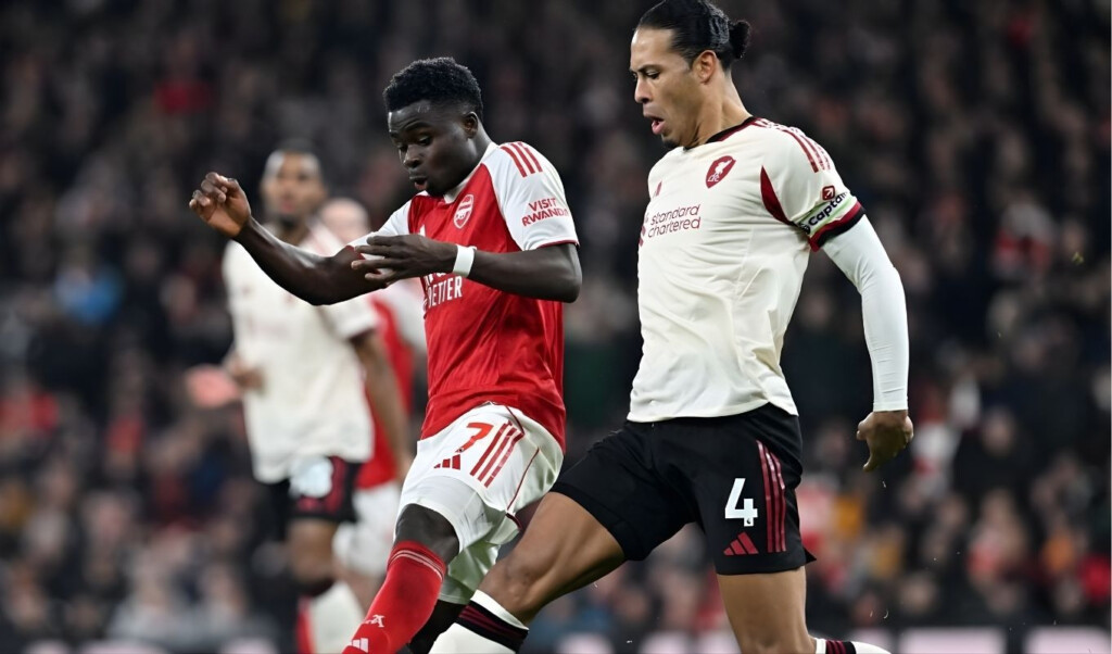 arsenal holds onto top spot despite drawing with liverpool Arsenal holds onto top spot despite drawing with Liverpool.