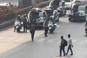 “At Karwan Bazar, halted by the presidential motorcade’s signal”
