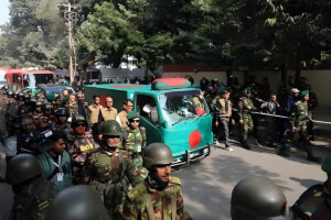 Khaleda Zia’s body is being transported to Manik Mia in a flag-draped vehicle