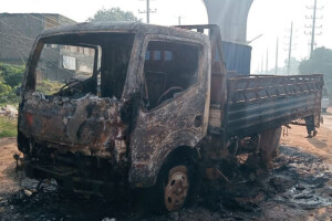 Miscreants set fire to a pickup van parked beside the road in Ashulia