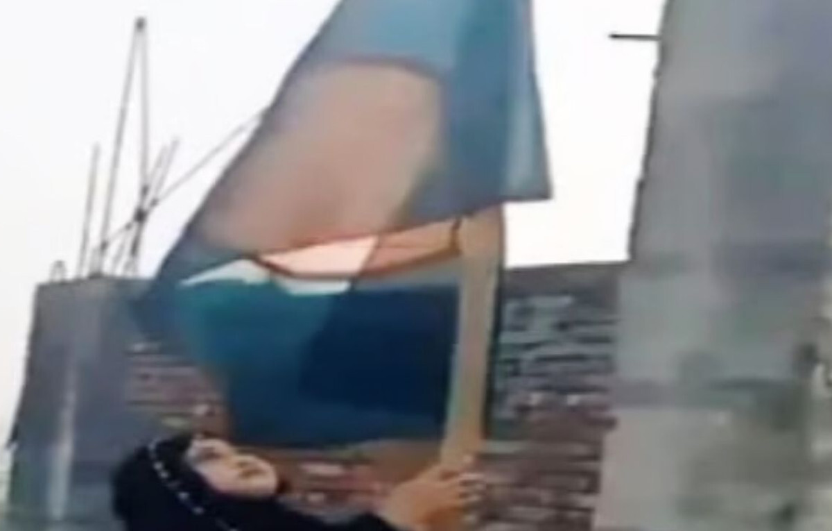 Symbolic Flag Hoisting at Abandoned Party Office