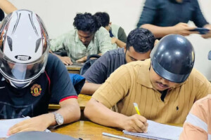 Students Wear Helmets Amid Safety Fears at Jagannath University