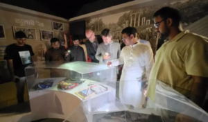 US Diplomats Tour DU July Museum by Phone Flashlight